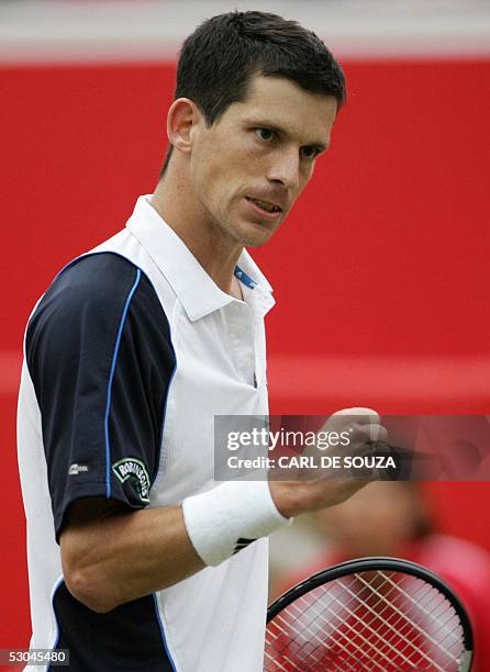 British player Tim Henman celebrates after beating Australian Chris Guccione at Queens Tennis club on the fourth day of the Stella Artois Tennis...