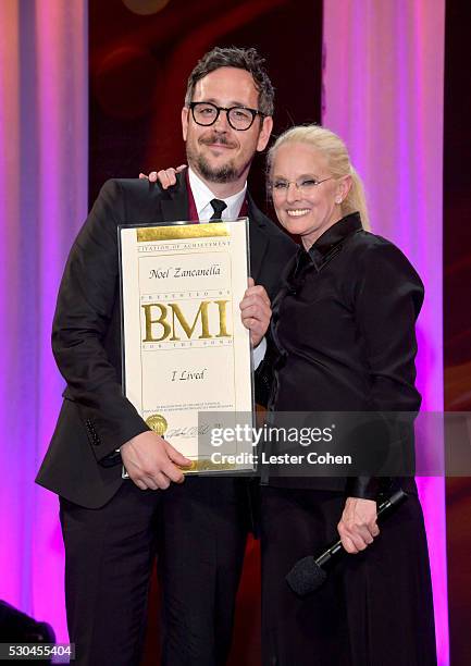 Songwriter Noel Zancanella poses with award and BMI Vice President & General Manager, Writer/Publisher Relations Barbara Cane onstage at The 64th...