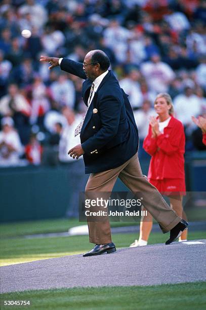 Former Cleveland Indian Larry Doby throws the ceremonial first pitch prior to a game on October 11, 1997. Larry Doby was the first African-American...