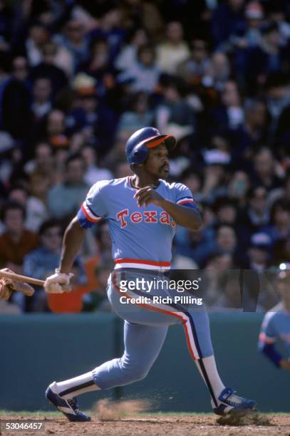 Al Oliver of the Texas Rangers heads toward first as he watches the flight of his hit during a game at Fenway Park in Boston, Massachusetts.