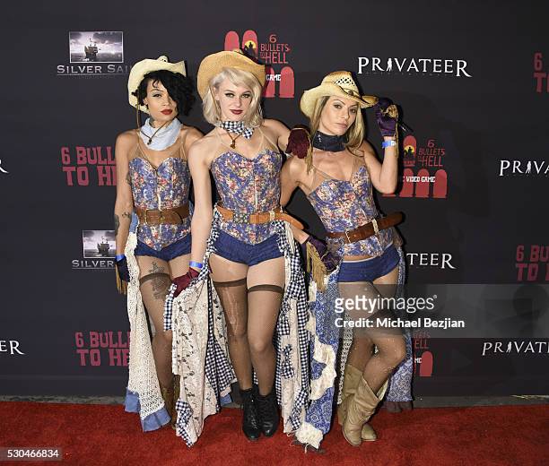 Performers arrive at the "6 Bullets To Hell" Mobile Game Launch Party on May 10, 2016 in Los Angeles, California.