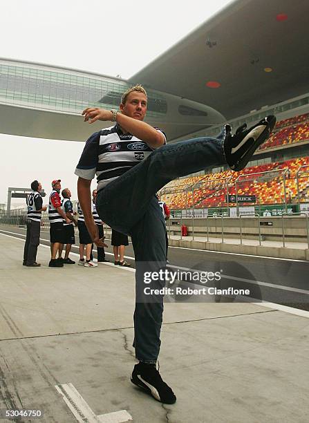 Ford driver Steven Johnson plays a game of Aussie Rules at the Shanghai International Circuit prior to qualifying for round 5 of the V8 Supercar...