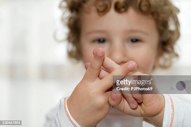 little boy showing hashtag sign - sign stock pictures, royalty-free photos & images