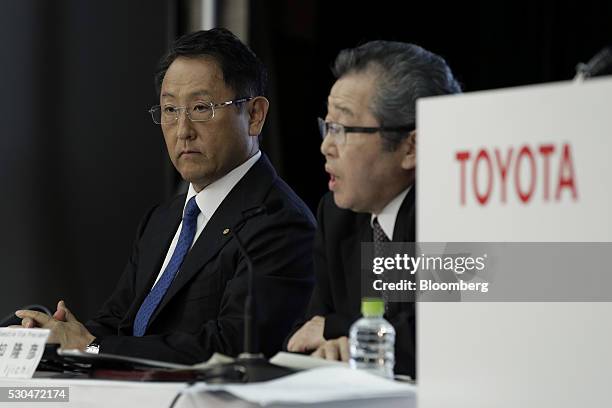 Akio Toyoda, president of Toyota Motor Corp., left, looks on while Takahiko Ijichi, executive vice president of Toyota Motor Corp., speaks during a...