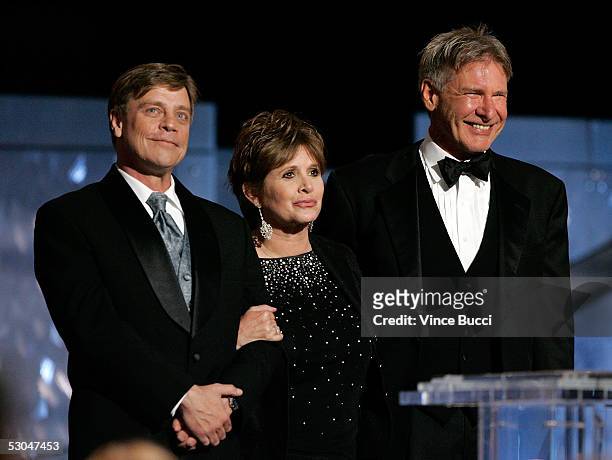 Actors Mark Hamill, Carrie Fisher and Harrison Ford speak onstage during the 33rd AFI Life Achievement Award tribute to George Lucas at the Kodak...