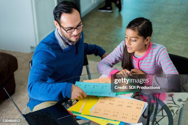 dad helps daughter with math homework - math homework stock pictures, royalty-free photos & images