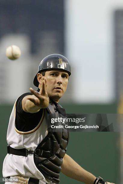 Catcher Humberto Cota of the Pittsburgh Pirates reaches for a new ball thrown to him by the umpire during a game against the Florida Marlins at PNC...