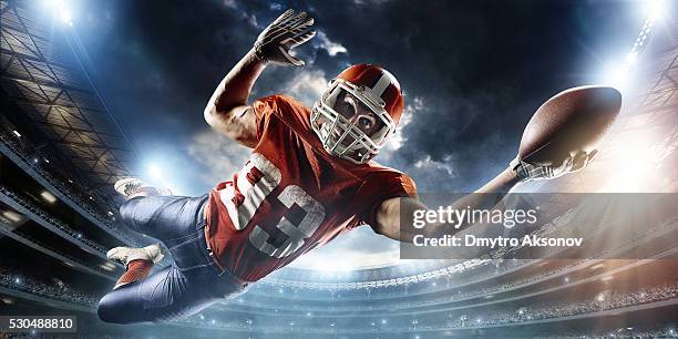 football player catches a ball - american football player white background stock pictures, royalty-free photos & images