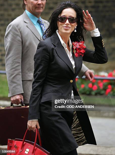 London, UNITED KINGDOM: The companion of England's national soccer manager Sven Goran Eriksson, Nancy Dell'Ollio, leaves No. 10 Downing Street 10...