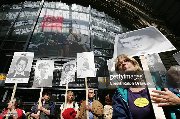 Demonstrators display pictures of Jewish children at Frankfurt's main train station on June 10, 2005 in Frankfurt, Germany. During World War II the...