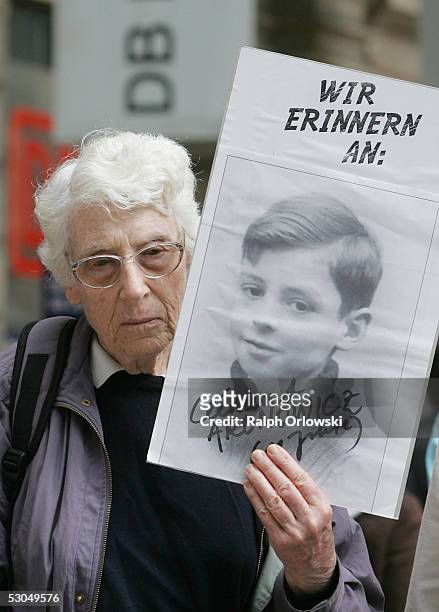 Woman displays a picture of a Jewish boy at Frankfurt's main train station on June 10, 2005 in Frankfurt, Germany. During World War II the 'Deutsche...