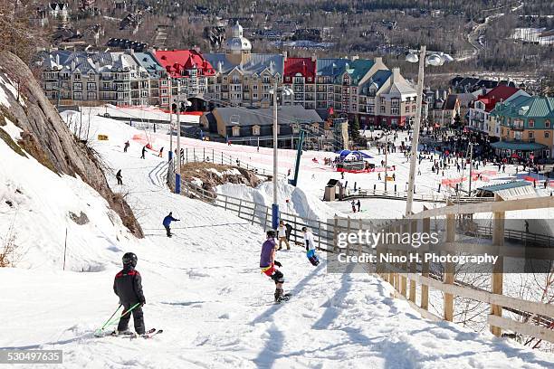 skiing in tremblant - mont tremblant ski village stock pictures, royalty-free photos & images