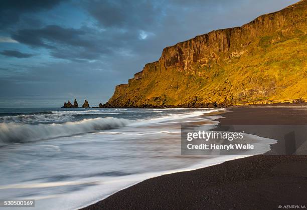 reynisdrangar - black sand stock pictures, royalty-free photos & images