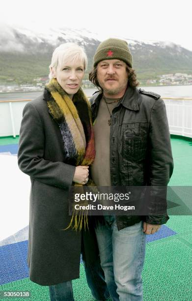 Artists Annie Lennox and Zucchero pose at a photocall ahead of tomorrow night's "46664 Arctic" concert, on the costal ship MS Kong Harald on June 10,...
