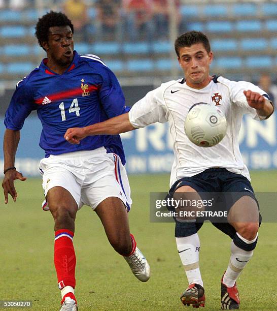 France's midfielder Yoann Folly vies with Portugal's defender Pedro Araujo during their "Festival International Espoirs" final football match...