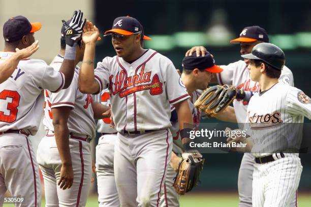 Andruw Jones of the Atlanta Braves celebrates with teammates after a National League divisional series game Houston Astros at Enron Field in Houston,...