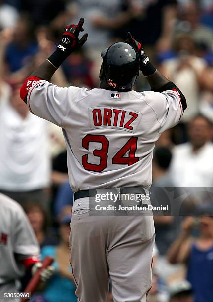 David Ortiz of the Boston Red Sox celebrates the first of his two home runs against the Chicago Cubs in the sixth inning on June 10, 2005 at Wrigley...