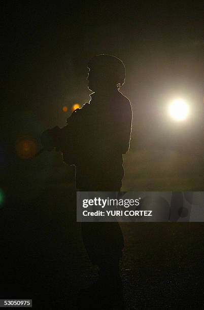 An US soldier of the Charlie Company 3rd BN 7th Infantry is seen patrolling the streets of neighbourhood in southern Baghdad, in the early morning,...