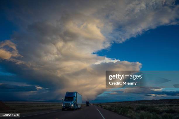 semi truck on american highway dramtic twilight sky - desert highway stock pictures, royalty-free photos & images