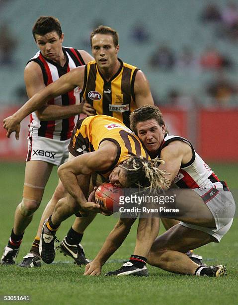 Steven Baker for the Saints tackles Chance Bateman for the Hawks during the round twelve AFL match between the Hawthorn Hawks and the St.Kilda Saints...