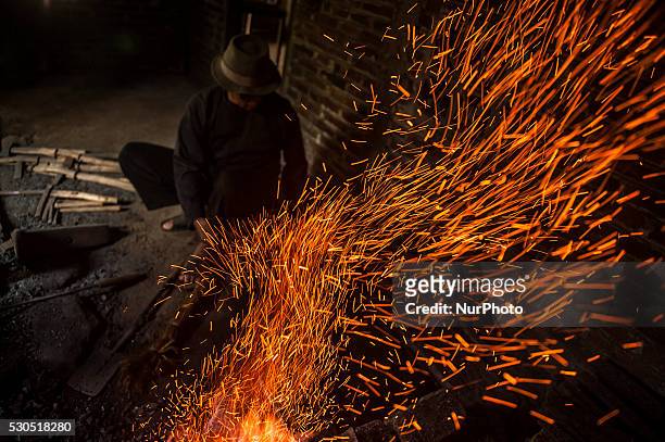 Ki Empu Sungkowo iron burn when making kris in Gatak Village, Yogyakarta, Indonesia, on May 10, 2016. Art Wrought Kris Ki Empu Sungkowo since 1995...