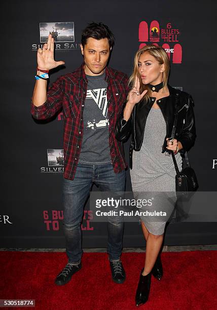 Actors Blair Redford and Cassie Scerbo attend the launch of "6 Bullets To Hell" the video game and the movie on May 10, 2016 in Los Angeles,...