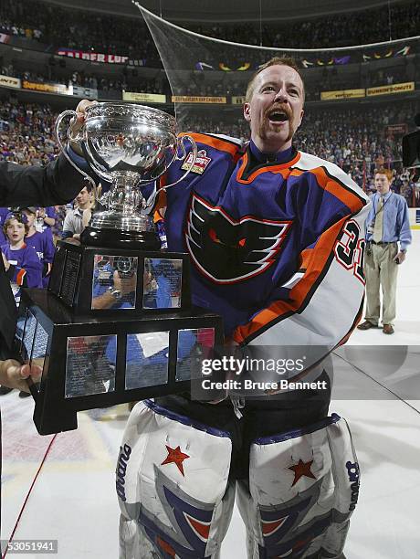 Neil Little of the Philadelphia Phantoms celebrates with the Calder Cup after the Phantoms defeated the Chicago Wolves 5-2 to sweep the series at the...