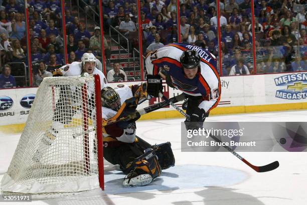 Todd Fedoruk of the Philadelphia Phantoms sails past Kari Lehtonen of the Chicago Wolves during game four of the Calder Cup Championship where the...