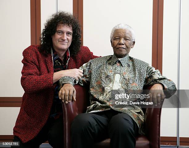 Artist Brian May poses with Nelson Mandela at a photocall ahead of tonight's "46664 Arctic" concert, at the Rica Hotel on June 11, 2005 in Tromso,...