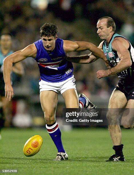 Ryan Griffin of the Bulldogs fights for the ball with Josh Francou of Power in action during the AFL round twelve match between the Port Adelaide...