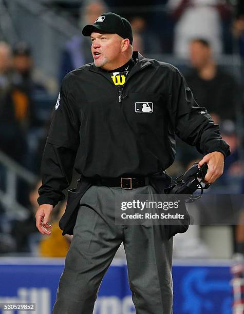 Home plate umpire Ron Kulpa yells to David Ortiz of the Boston Red Sox in the ninth inning during a game at Yankee Stadium on May 6, 2016 in the...