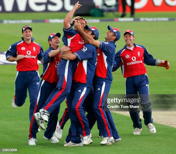 Darren Gough of England is mobbed after taking the wicket of Chris Denham of Hampshire to complete his hat trick during the England v Hampshire One...
