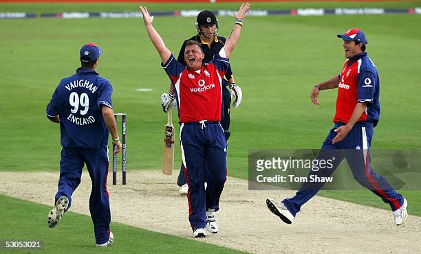 Darren Gough of England celebrates with Michael Vaughan and kevin Pietersen after taking the wicket of Chris Denham of Hampshire to complete his hat...