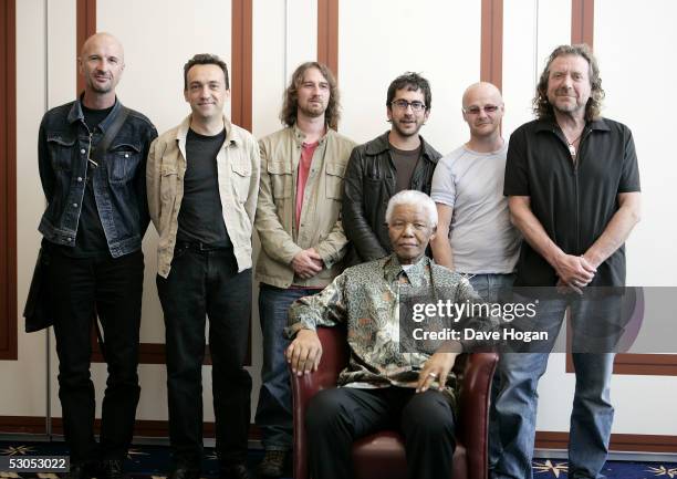 Artist, members of The Strange Sensation Clive Deamer, Justin Adams, Skin Tyson, Billy Fuller, John Baggott and Robert Plant pose with Nelson Mandela...
