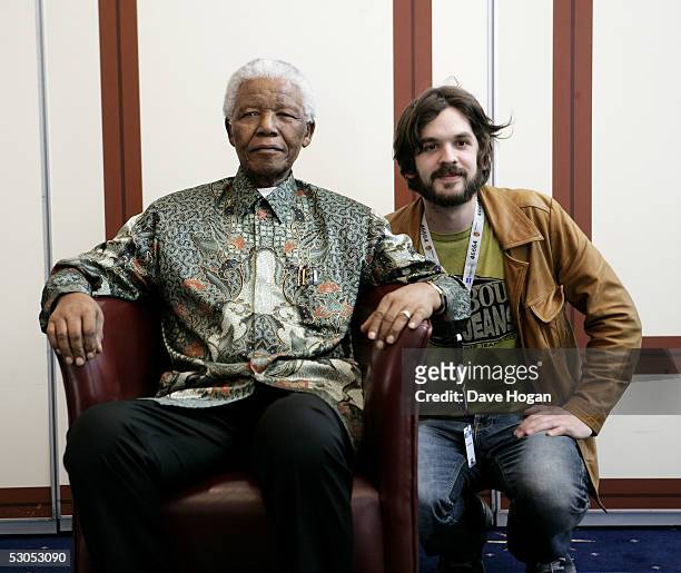 Norwegian artist Thomas Dybdahl poses with Nelson Mandela at a photocall ahead of tonight's "46664 Arctic" concert, at the Rica Hotel on June 11,...