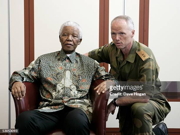Major General Robert Mood of the Norwegian Army poses with Nelson Mandela at a photocall ahead of tonight's "46664 Arctic" concert, at the Rica Hotel...