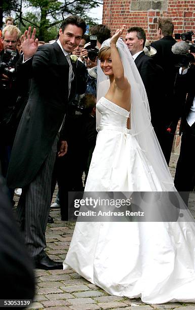 Ex Tennis player Michael Stich and his wife Alexandra Stich, maiden name Rikowski, pose at the Sankt Severin church on June 11, 2005 at Sylt, in...