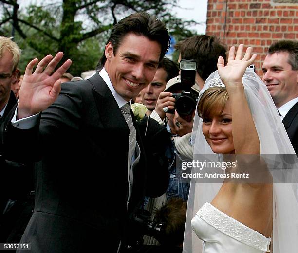 Ex Tennis player Michael Stich and his wife Alexandra Stich, maiden name Rikowski, pose at the Sankt Severin church on June 11, 2005 at Sylt, in...