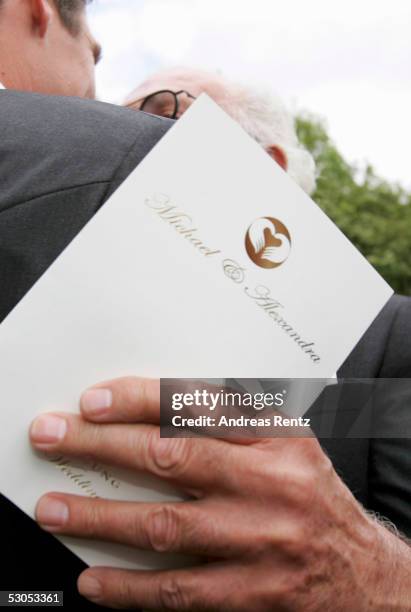 Unidentfied guest holds the wedding invatation at the Sankt Severin church on June 11, 2005 at Sylt, in Germany. Michael Stich and Alexandra Rikowski...