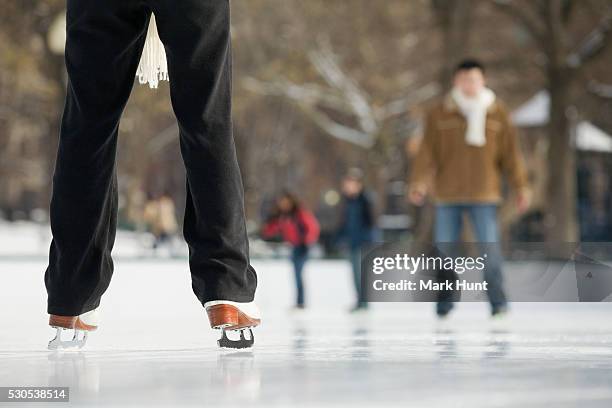 people ice-skating in a public park - boston common stock pictures, royalty-free photos & images