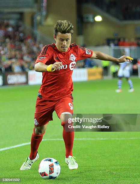 Tsubasa Endoh of Toronto FC dribbles the ball during the second half of an MLS soccer game against FC Dallas at BMO Field on May 7, 2016 in Toronto,...