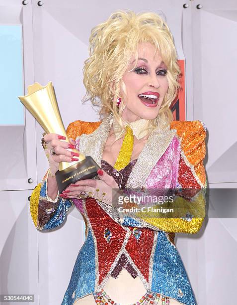 Singer-songwriter and producer Dolly Parton, winner of the Tex Ritter Award for 'Dolly Parton's Coat of Many Colors,' poses in the press room during...