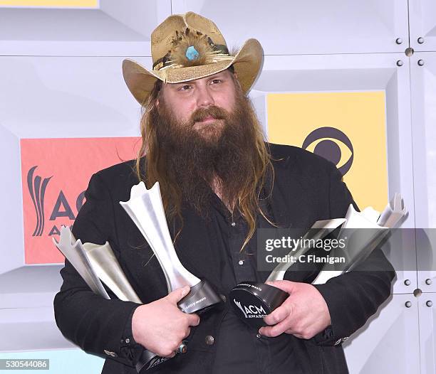 Singer-songwriter Chris Stapleton, winner of the Male Vocalist of the Year, New Male Vocalist of the Year, and Album of the Year awards, poses in the...