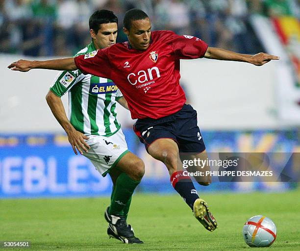 Osasuna soccer player Rochat Valdo shoots for the goal against Betis soccer player Juan Guttierrez during the King's Cup championship final football...