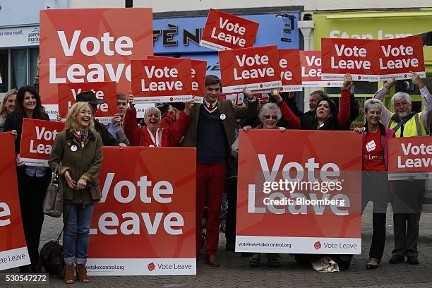 Supporters of the Vote Leave campaign cheer as they wait for Boris Johnson, the former mayor of London, during the first day of a nationwide bus tour...