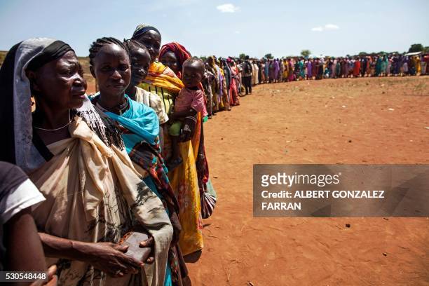 Internally displaced people recently arrived to Wau, South Sudan, due to armed clashes in surrounding villages, wait to be registered by the...