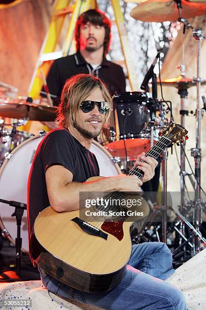 Taylor Hawkins and Dave Grohl of The Foo Fighters perform onstage during MTV2's "24 Hours Of Foo" at the MTV Times Square Studios June 11, 2005 in...