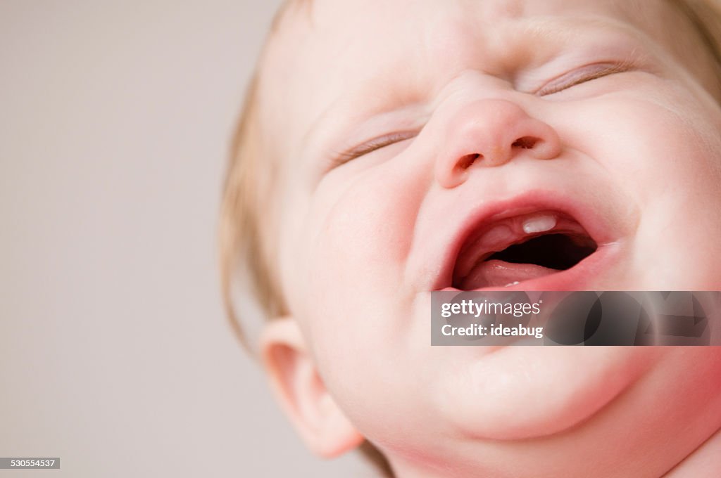 Crying Baby Suffering Through Pain of Teething