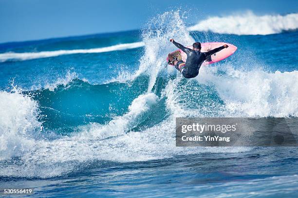 male surfer surfing the pacific ocean waves, kauai, hawaii - big wave surfing stock pictures, royalty-free photos & images