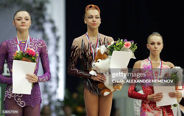 Winners of the ribbon event of 21th European Rythmic Gymnastics Championship in Moscow pose on the podium Ukraine's Anna Bessonova - silver,...